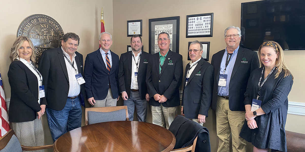 A group of Gibson Electric board members stand with Tennessee state senator John Stevens in his office in Nashville.