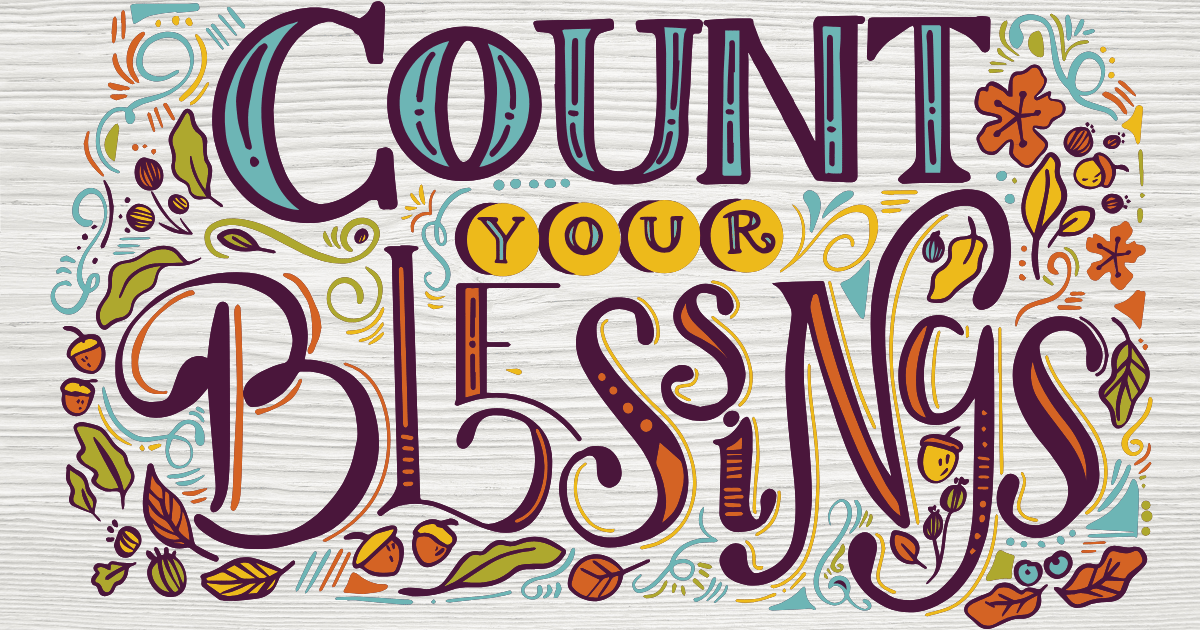 Colorful hand-lettered design reading ‘Count Your Blessings’ in bold decorative fonts. The words are surrounded by autumn-themed illustrations such as leaves, acorns, and swirls in orange, teal, yellow, and brown on a light wood-textured background.