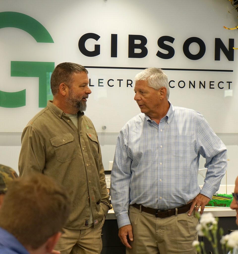 Barry Smith speaks with a guest at his retirement reception.