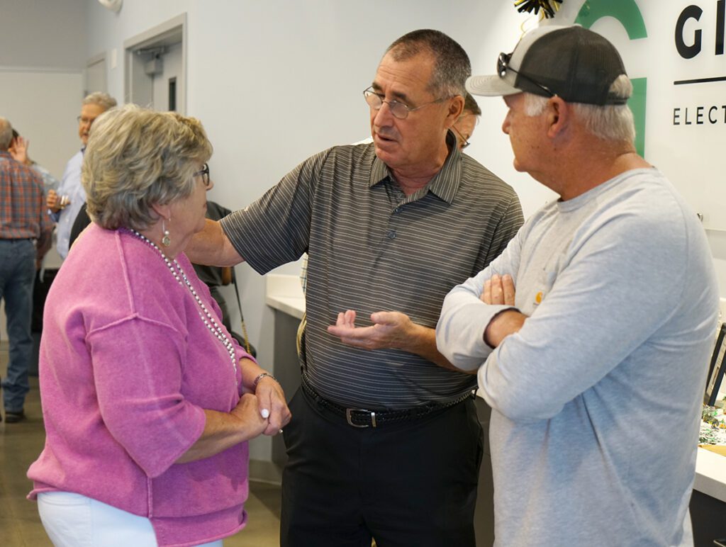 Dan Rodamaker speaks with guests at this retirement reception.
